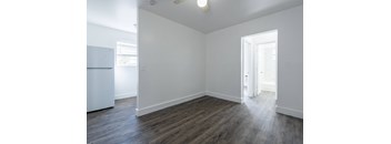 A room with a white wall and a white door.