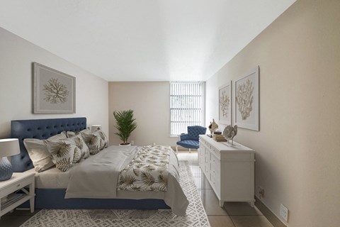 A bedroom with a large bed and a blue headboard.