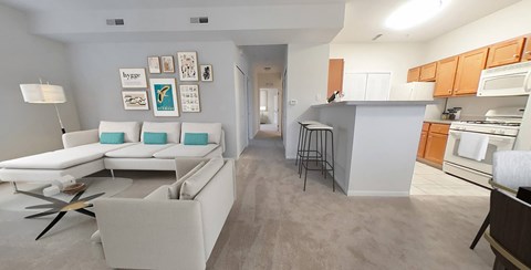 A modern living room with a white sofa and a coffee table.