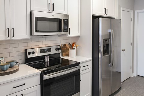 Newly renovated suites include quartz countertops, stainless steel appliances and matte black finishes and hardware (Legacy Series)