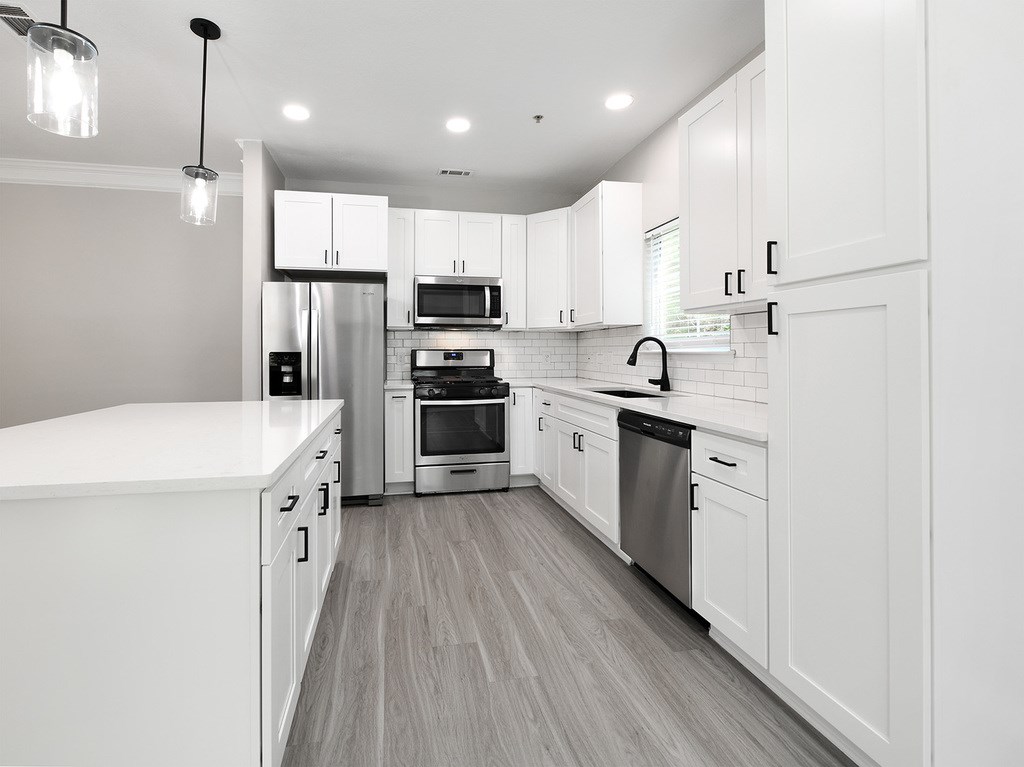 BRAND NEW SUITES - quartz countertops, stainless steel appliances, large islands and matte black finishes and hardware