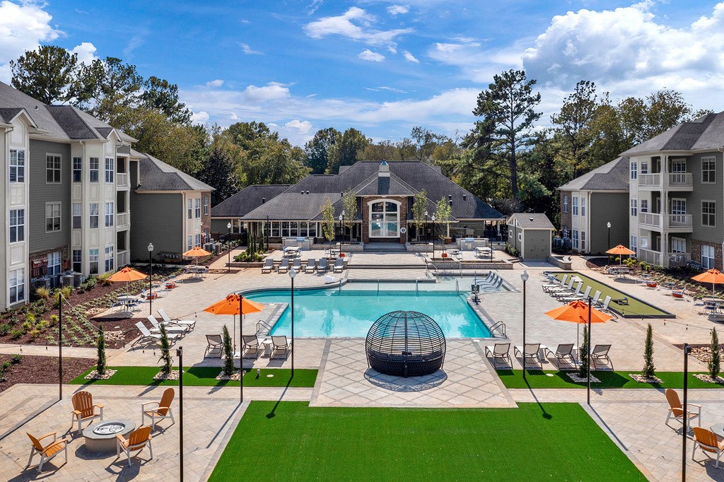 Large courtyard with saltwater pool, firepit, entertaining areas and gas grills