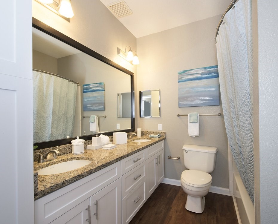 Dual vanities and framed mirrors in bathrooms