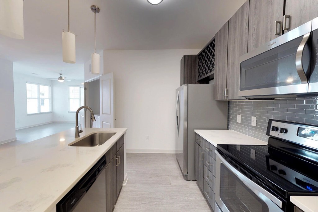 Chef's kitchens feature islands with quartz countertops