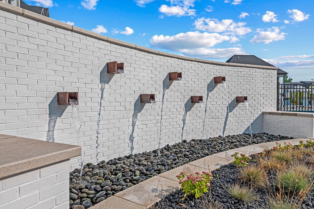 Wall fountain next to pool
