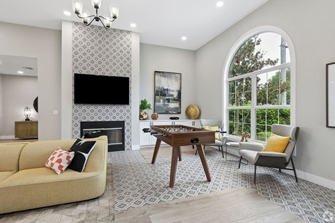 A living room with a fireplace and a couch.