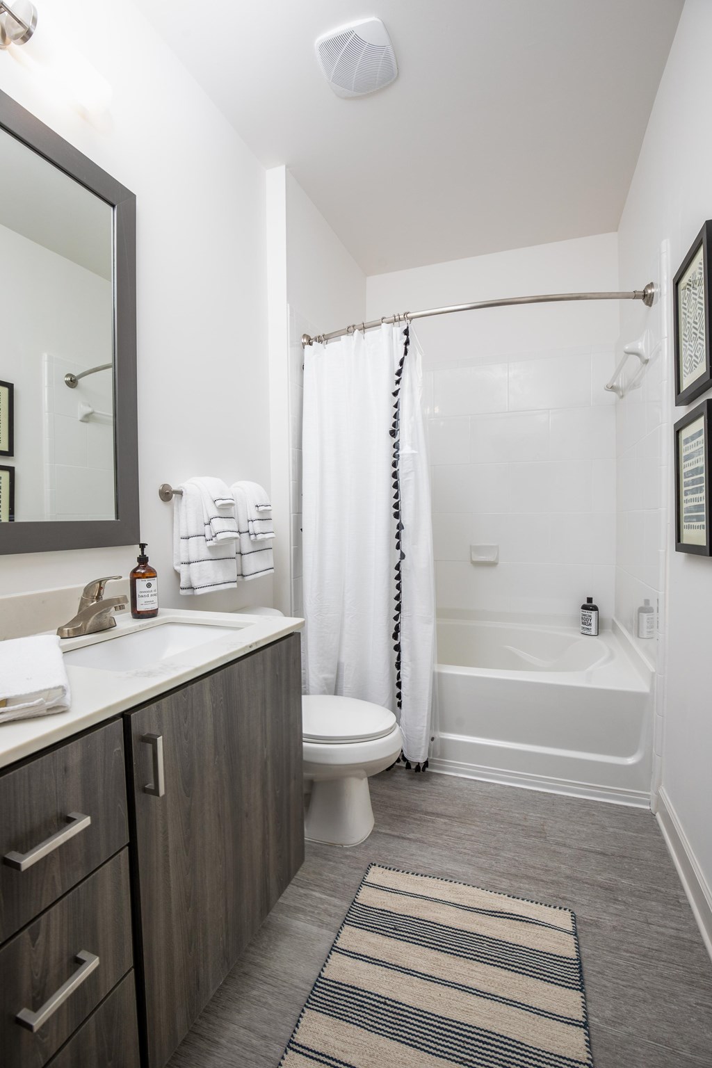 Bathrooms with garden soaking tubs, dual vanities and framed mirrors