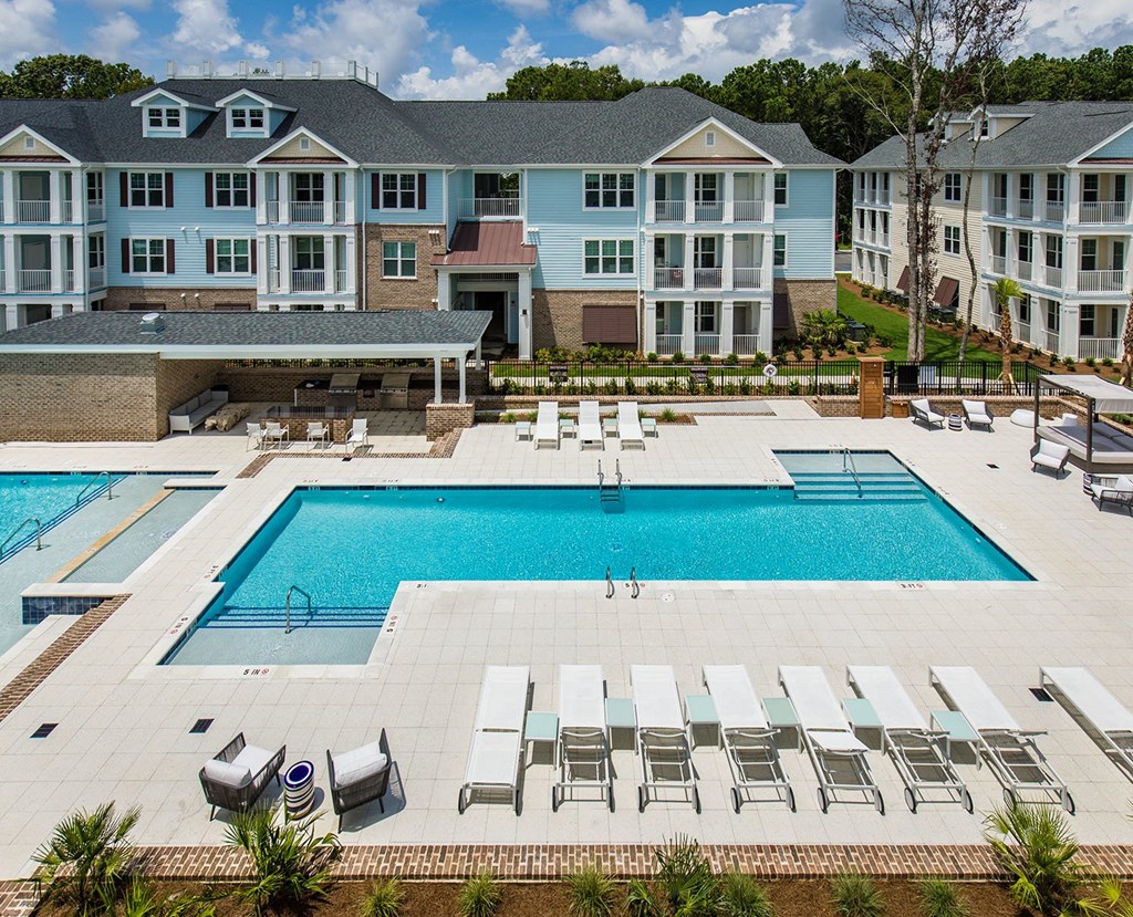 Bi-level saltwater pool with sundeck, cabanas and outdoor TV