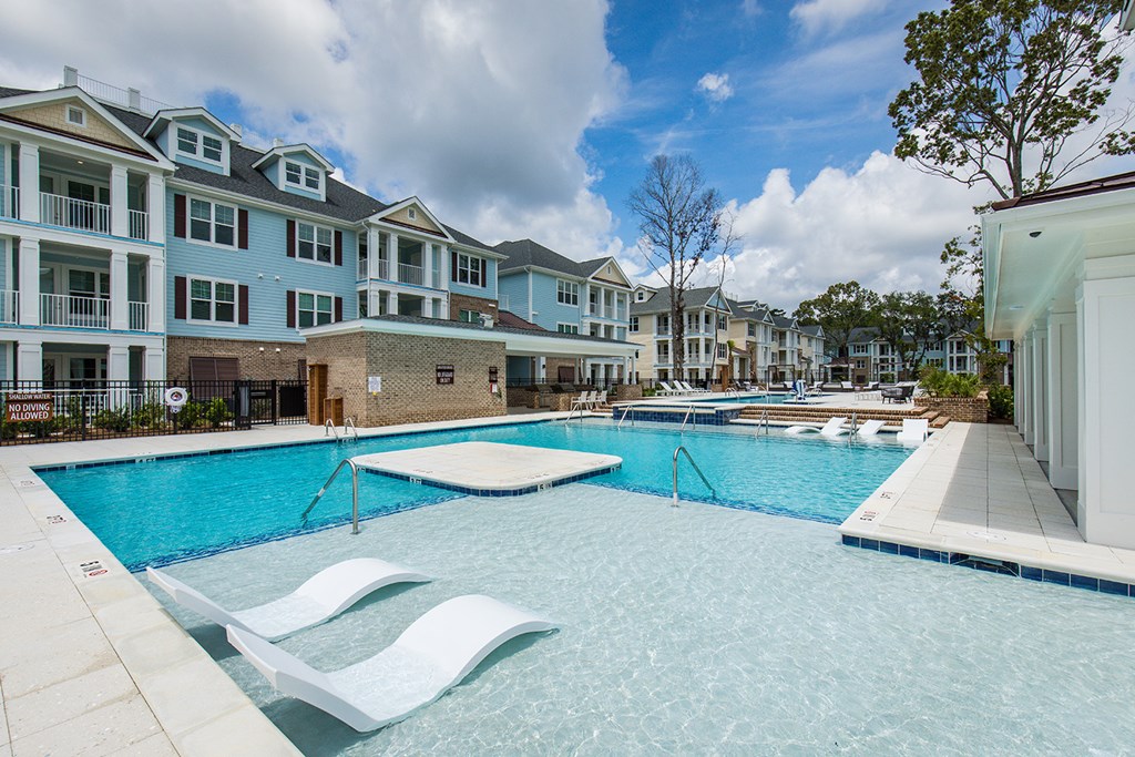 Bi-level saltwater pool with sundeck, cabanas and outdoor TV
