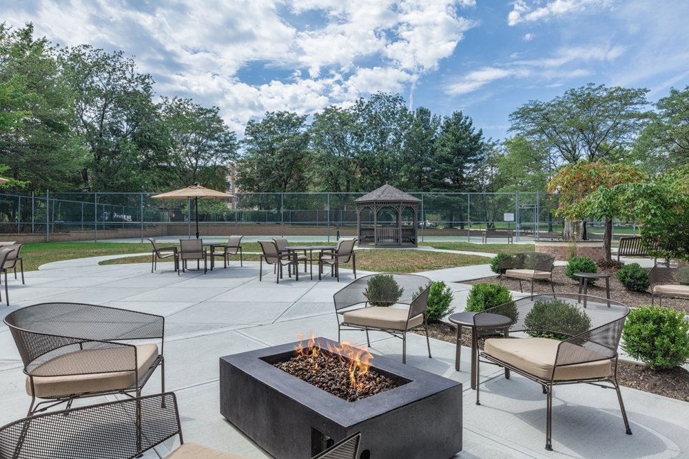 Outdoor entertaining area with grill and fire pit
