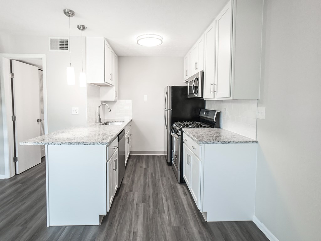 Kitchens with granite countertops and stainless steel appliances