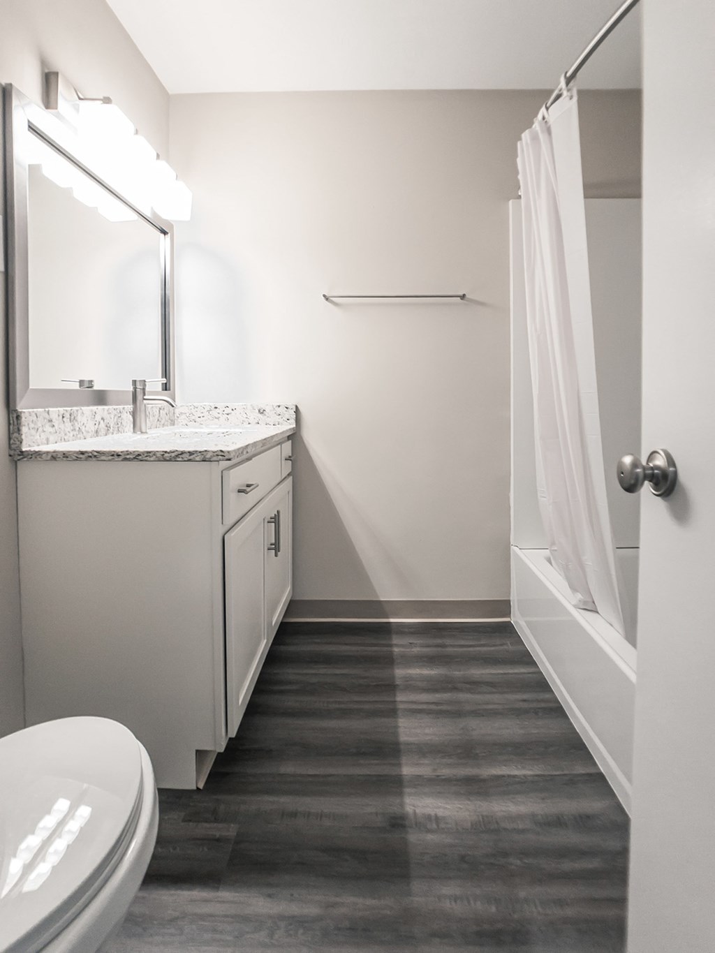 Bathrooms with granite countertops and bathtubs