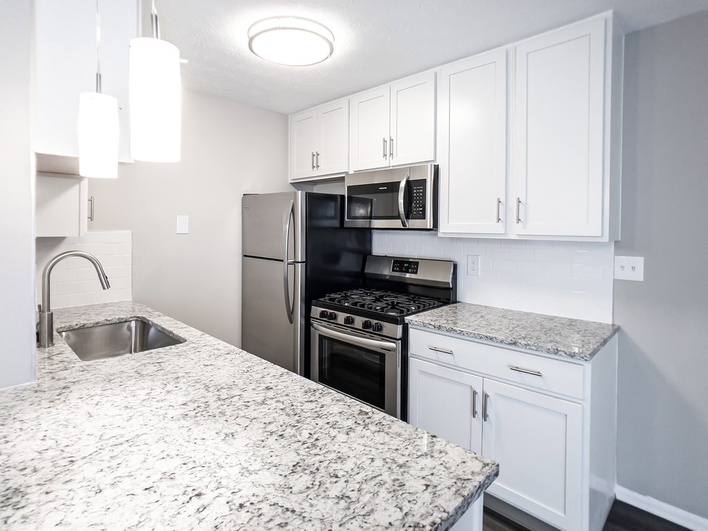 Stainless steel appliances in open concept kitchens