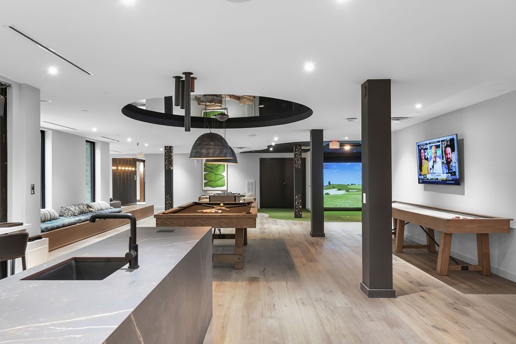 Social kitchen, pool table, virtual golf, and shuffleboard in gaming lounge