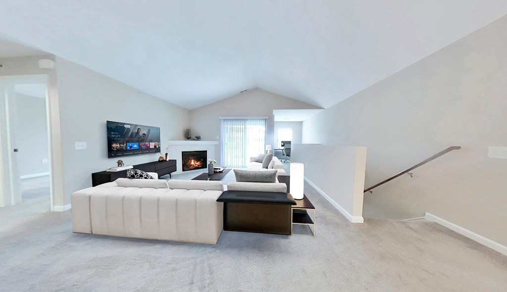 Spacious living rooms with fireplaces in select suites