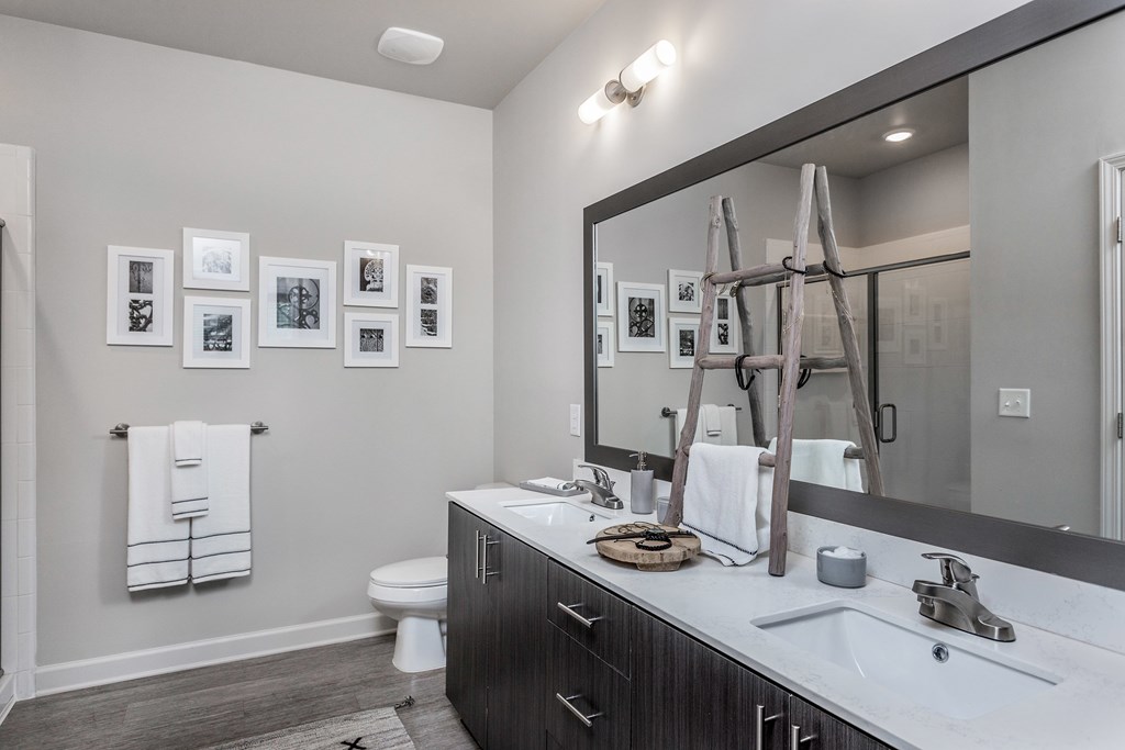 Spacious bathrooms with quartz countertops