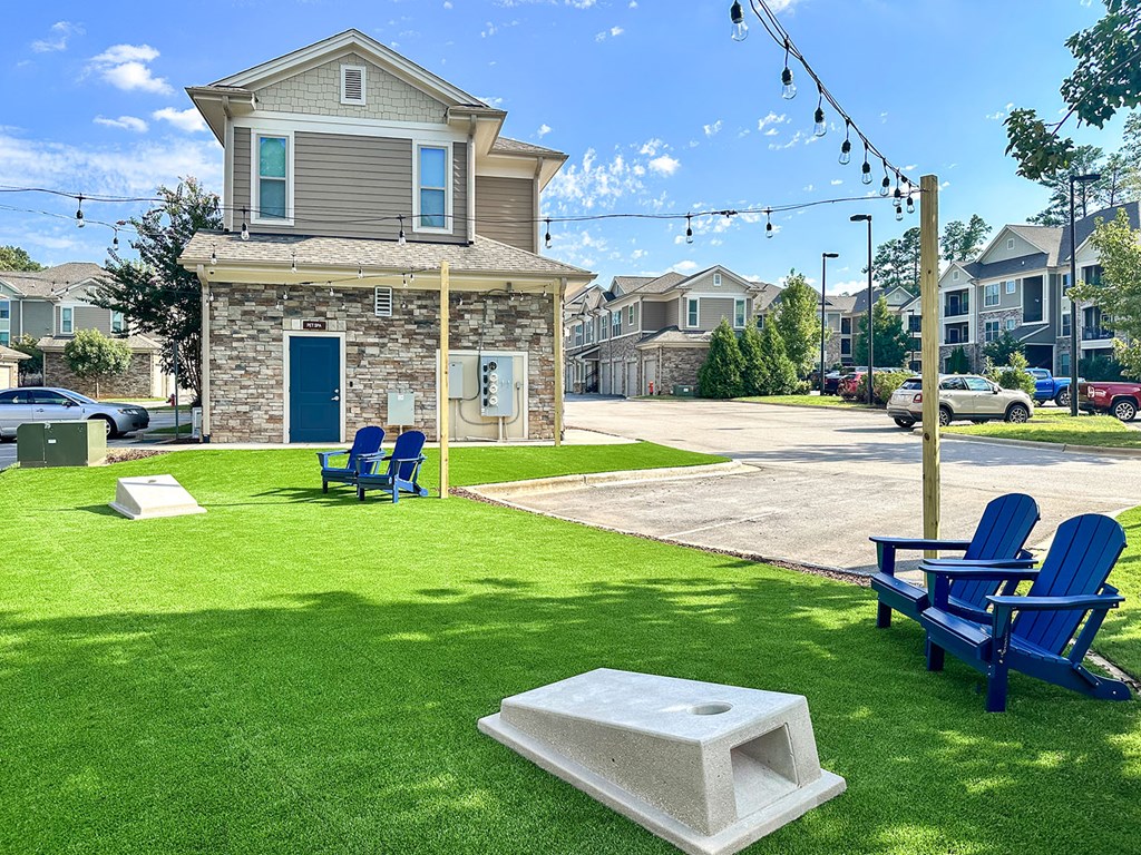 Outdoor entertaining area with cornhole