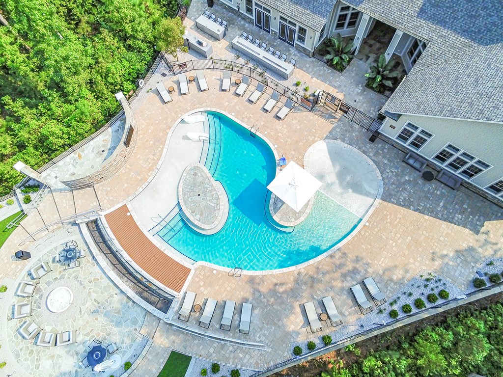 Beach-entry saltwater pool with sundeck, fire pit, TV and outdoor lounge