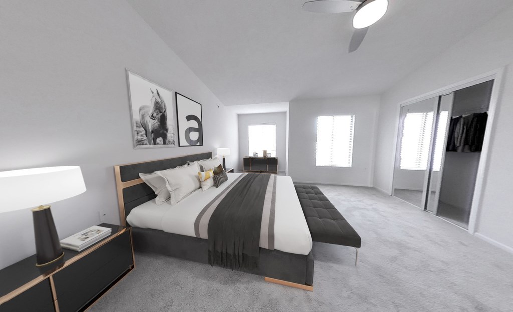 Bedroom with wall-to-wall oversized mirrored closet