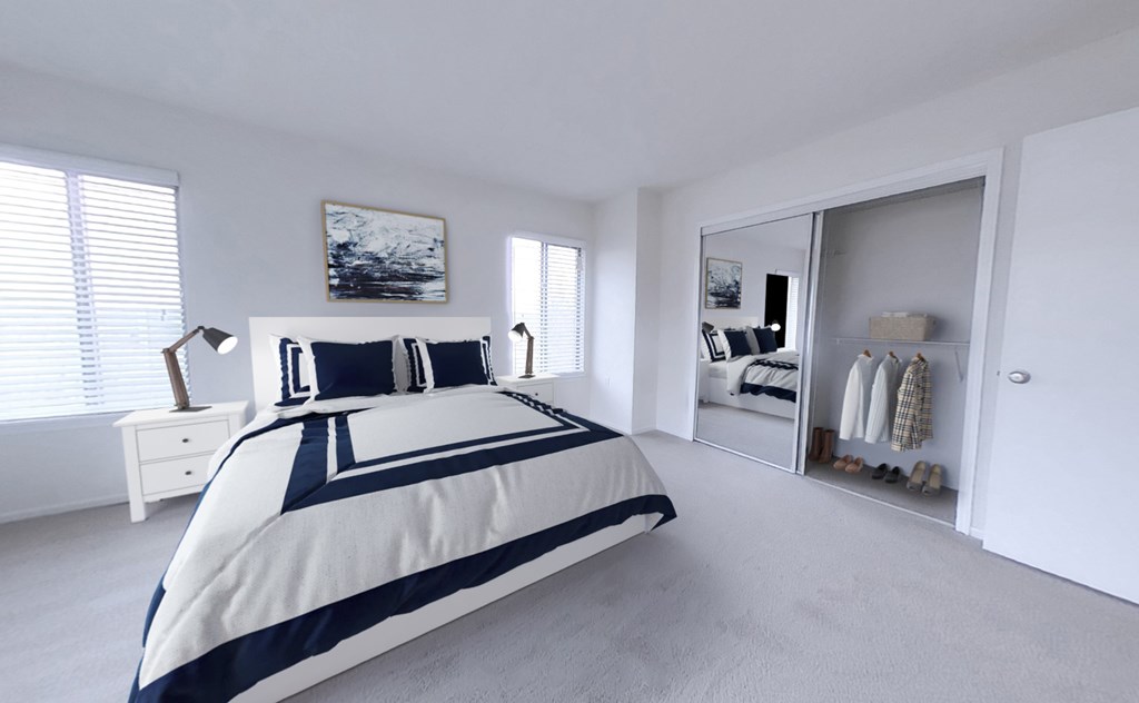 Bedroom with wall-to-wall oversized mirrored closet