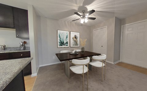 Dining rooms with overhead lighting and ceiling fan