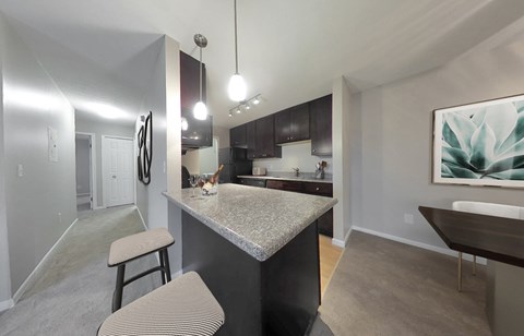 Deluxe 2-bedroom suites available with granite countertops and dark espresso cabinetry