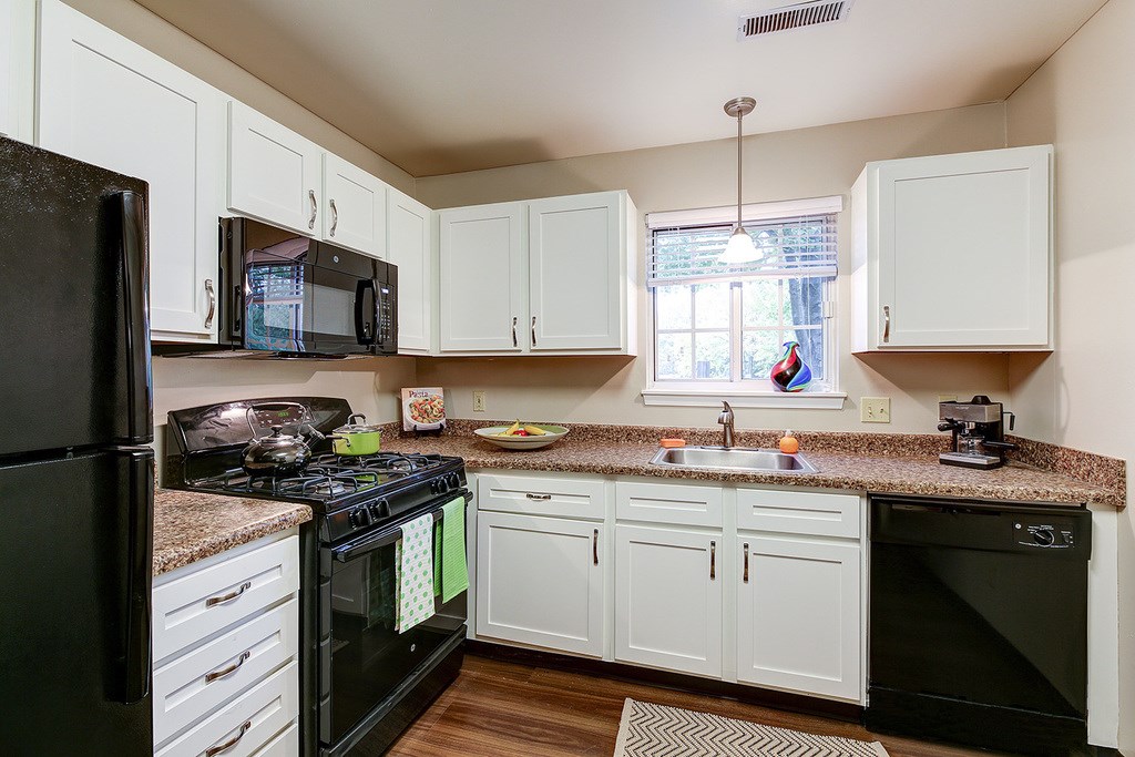 Fully-equipped kitchens with sleek black appliance package