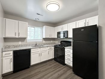 Fully-equipped kitchens with gas ranges and built-in microwaves