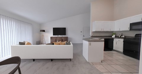 A modern kitchen with white cabinets and appliances.