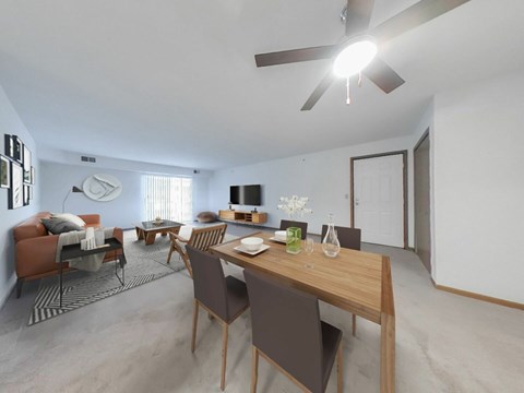 A modern living room with a dining table and chairs.