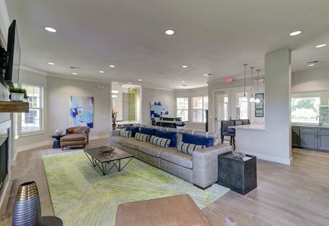 A spacious living room with a large sectional sofa and a coffee table.