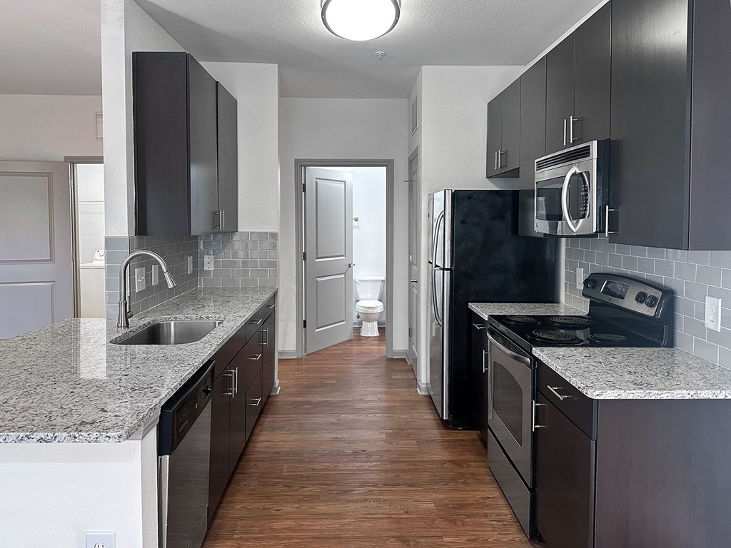 Garden suites with granite countertops and stainless steel appliances