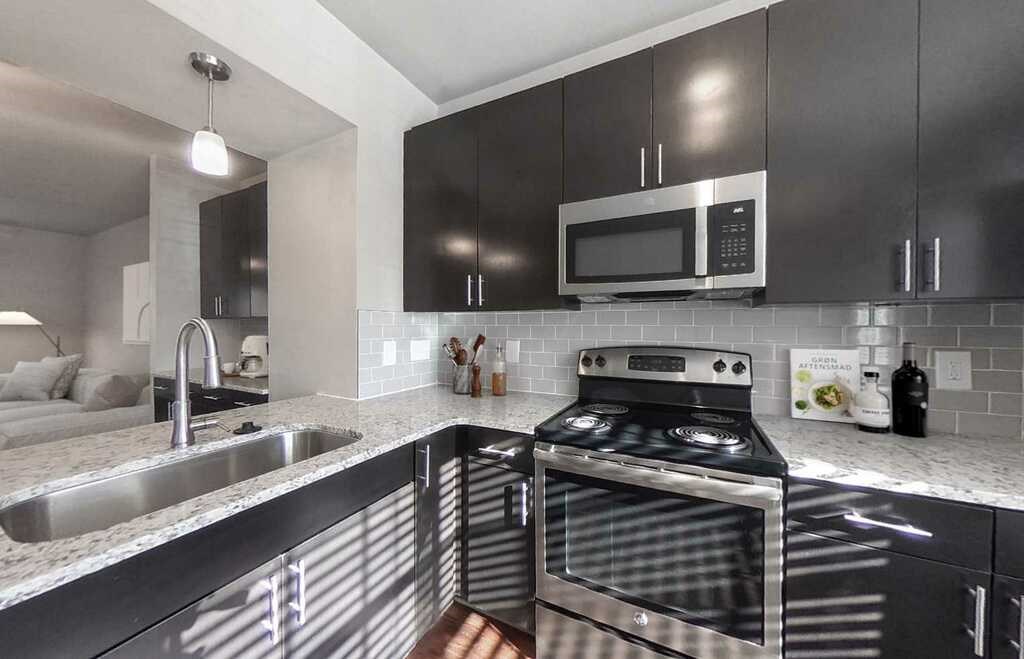 Townhomes feature fully-equipped kitchens with granite countertops