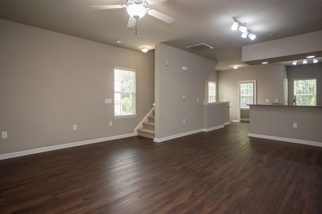 Large townhomes with overhead lighting and ceiling fans