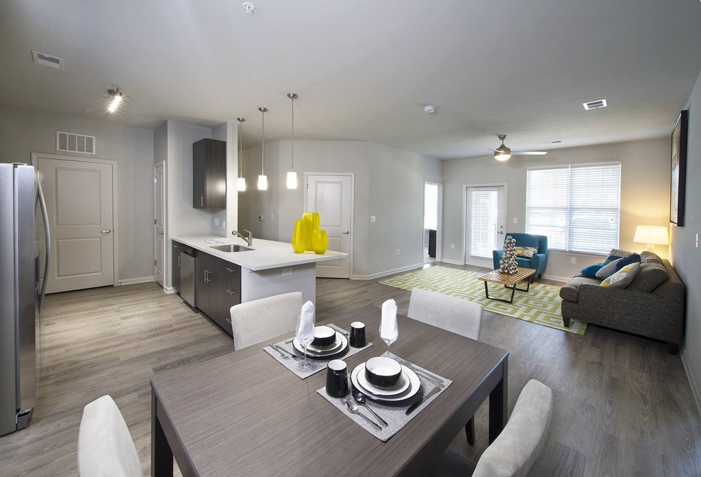Hardwood-inspired flooring in living room and kitchen areas