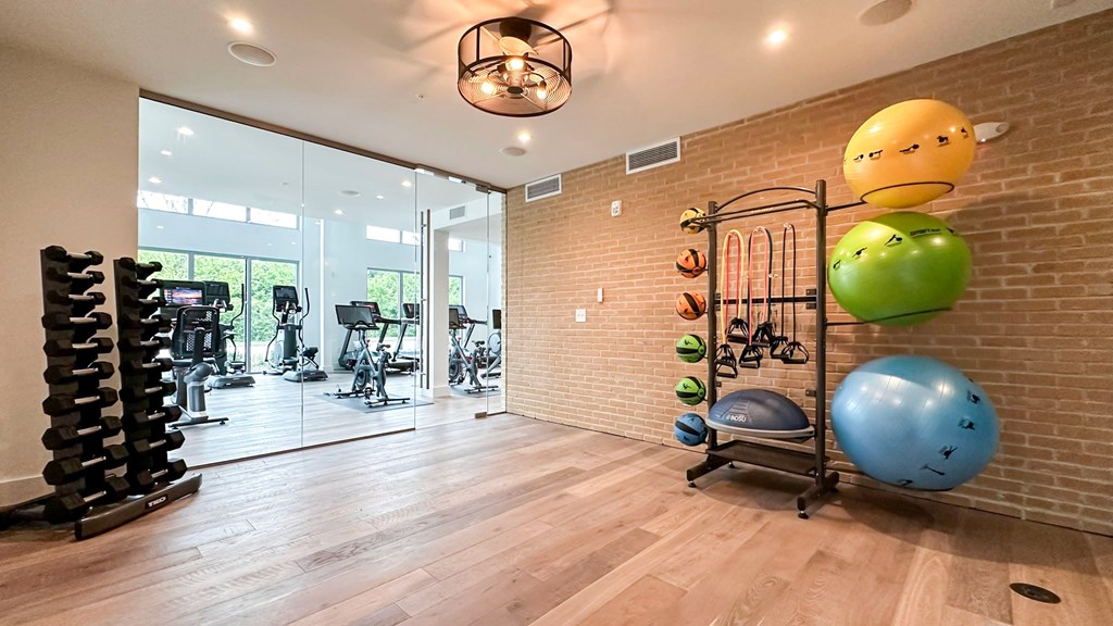 Bi-level fitness studio with personal training room and stationary bikes