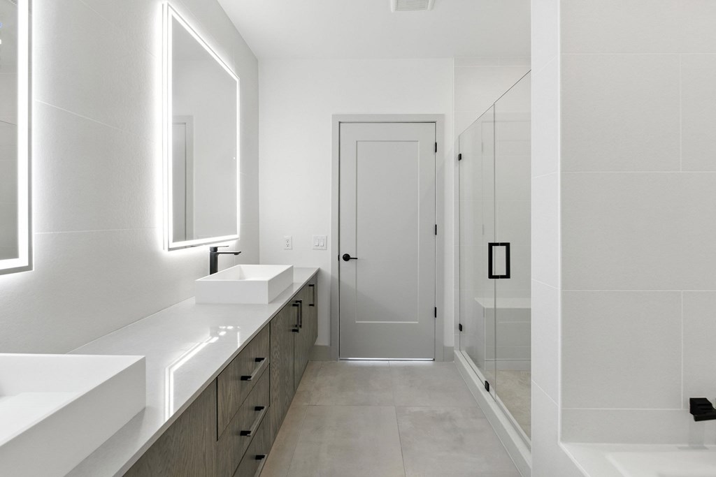 Dual bathroom vanities with quartz countertops