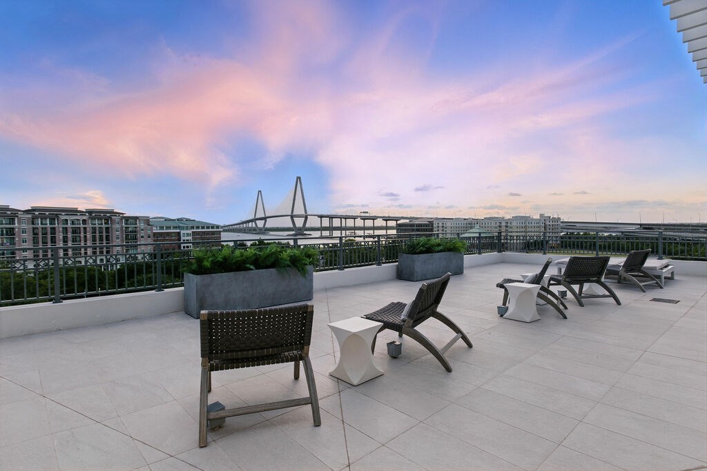 Expansive rooftop terrace with breathtaking views overlooking Charleston Harbor