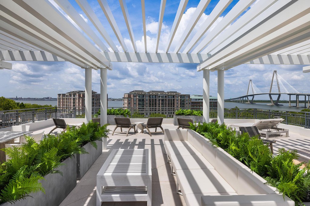 Expansive rooftop terrace with breathtaking views overlooking Charleston Harbor