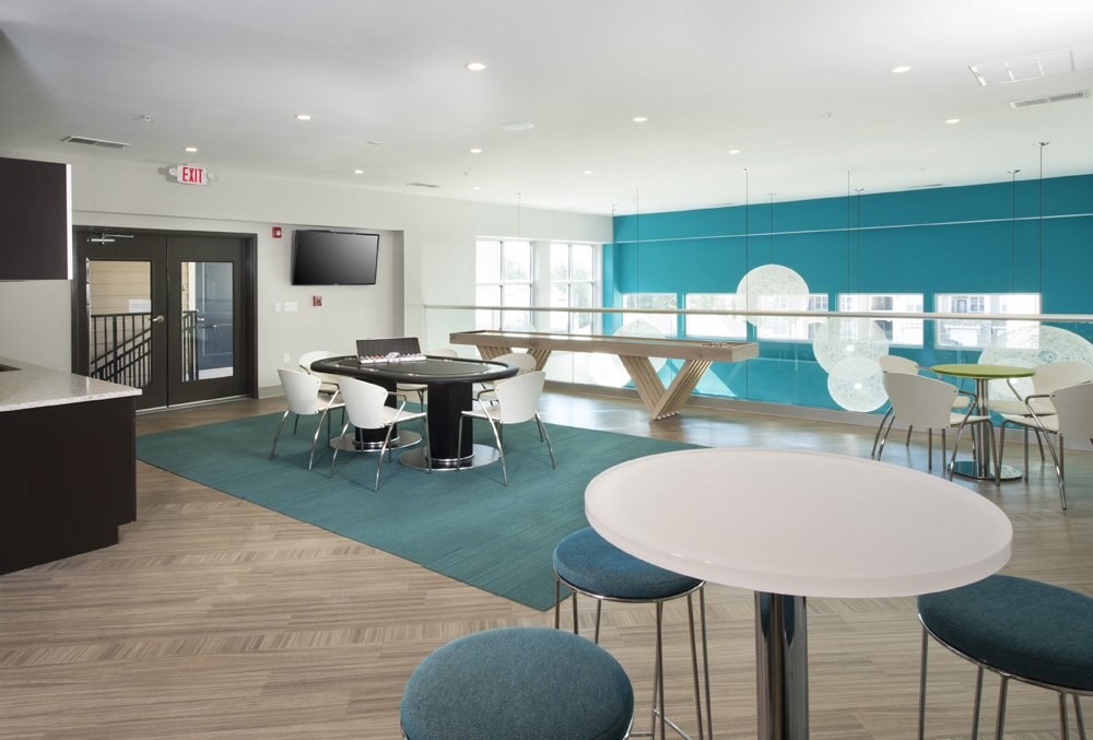 Gaming and entertaining space with poker table and shuffleboard