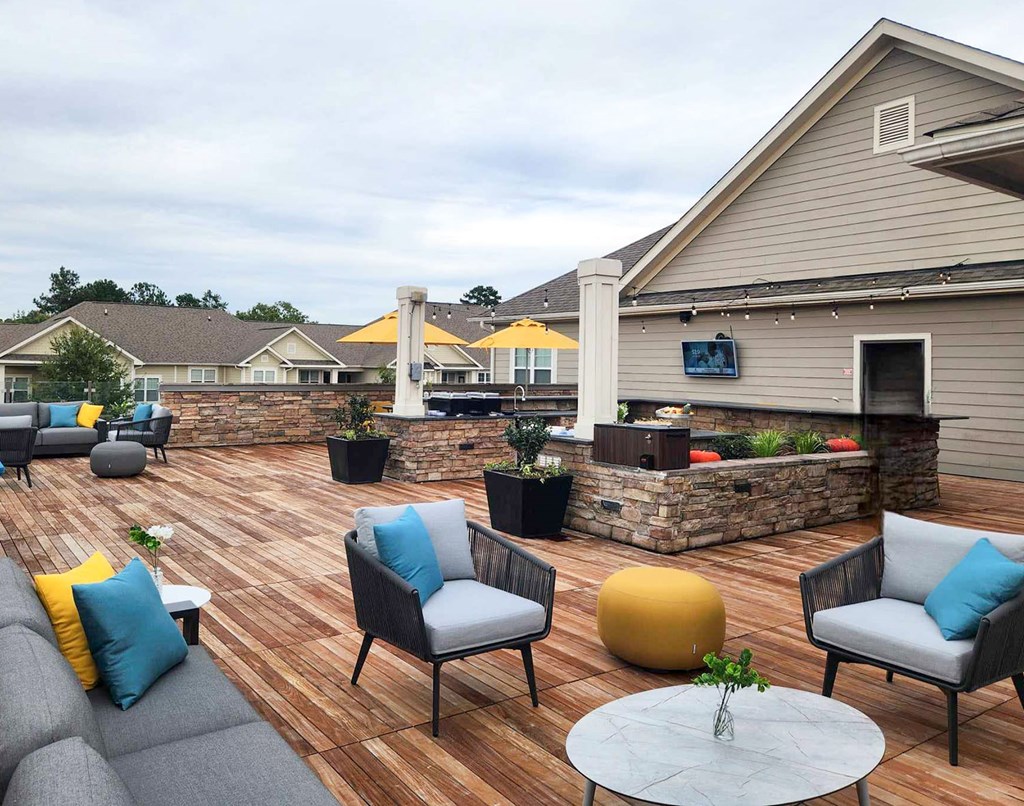 Rooftop clubhouse terrace with bar