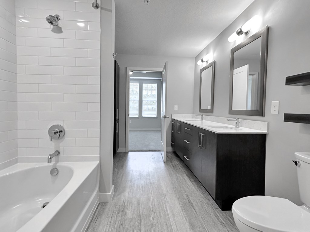 Garden soaking tubs with curved shower rods and tub to ceiling tile backsplash