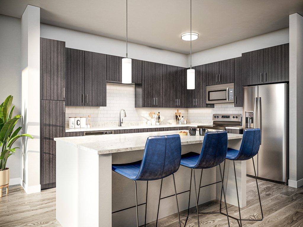 Quartz countertops and islands with overhead lighting