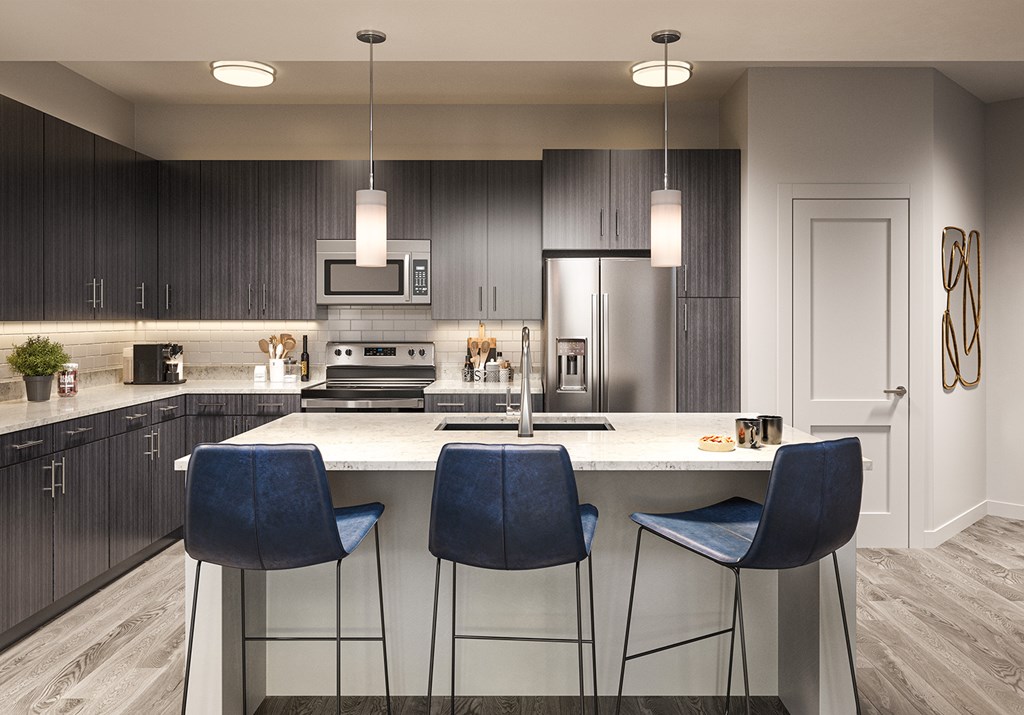 Quartz countertops and islands with overhead lighting