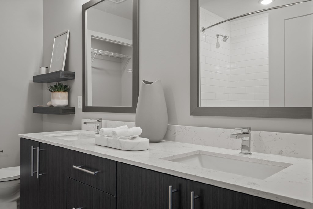 Dual vanities and framed mirrors in bathrooms