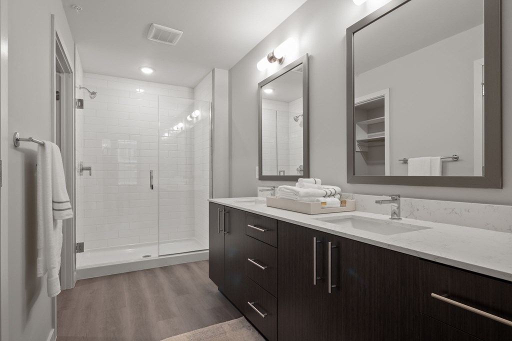 Dual vanities and framed mirrors in bathrooms