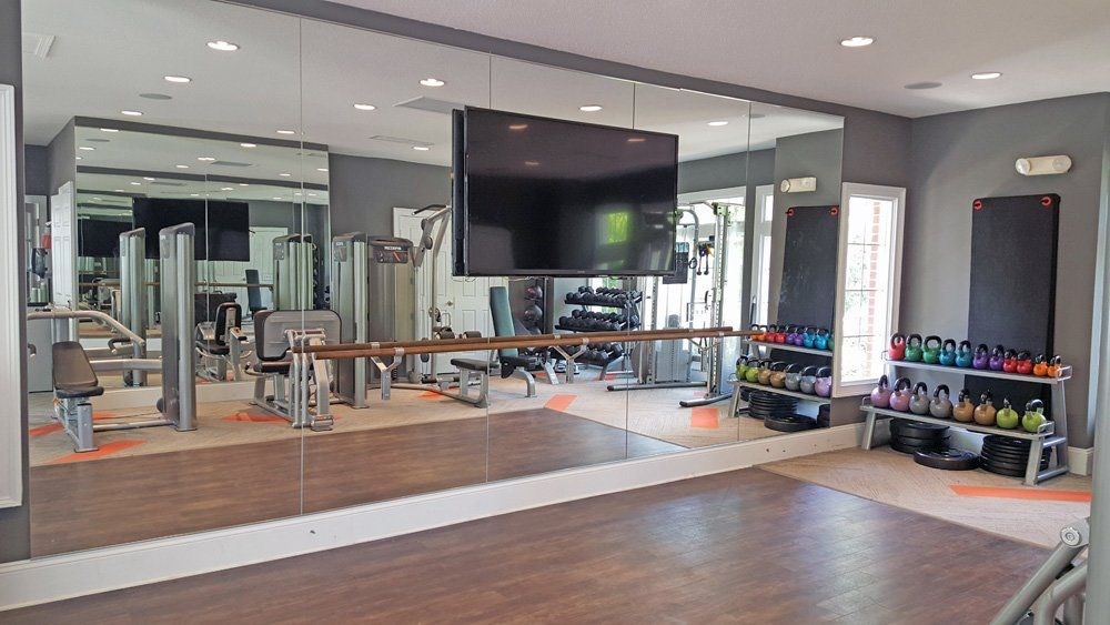 Fitness center with virtual training and barre bar