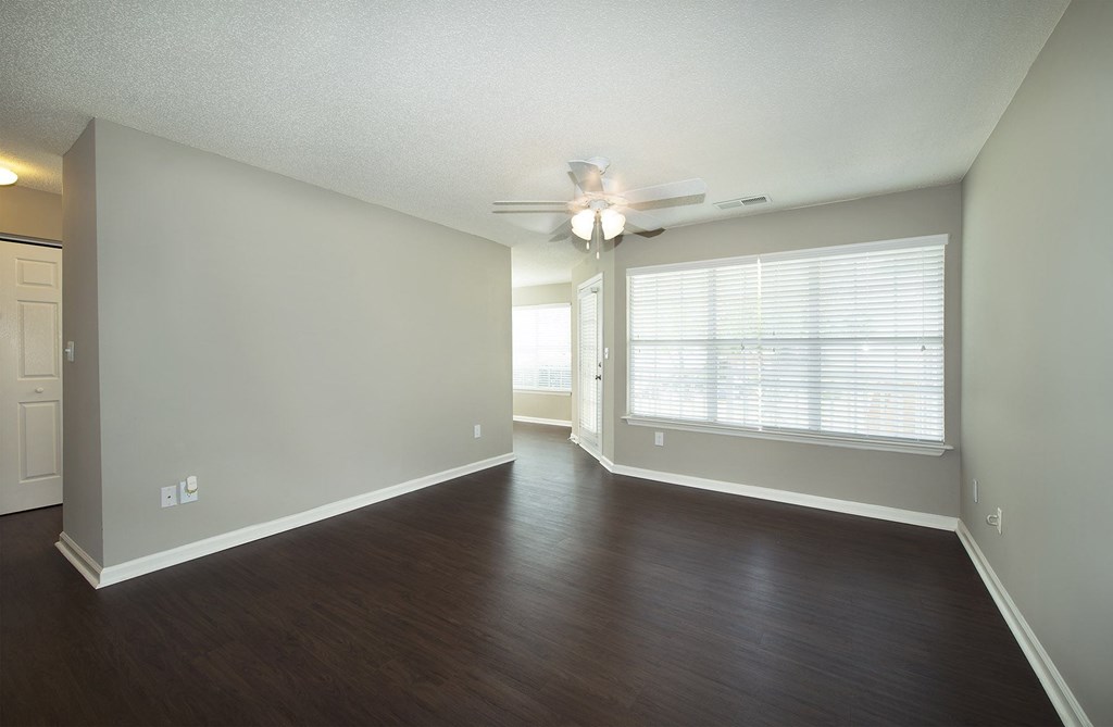 Open concept living areas with hardwood-inspired flooring (Signature)