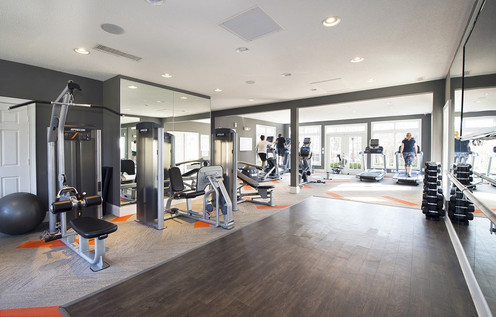Fitness center with cardio machines, weight stations and free weights