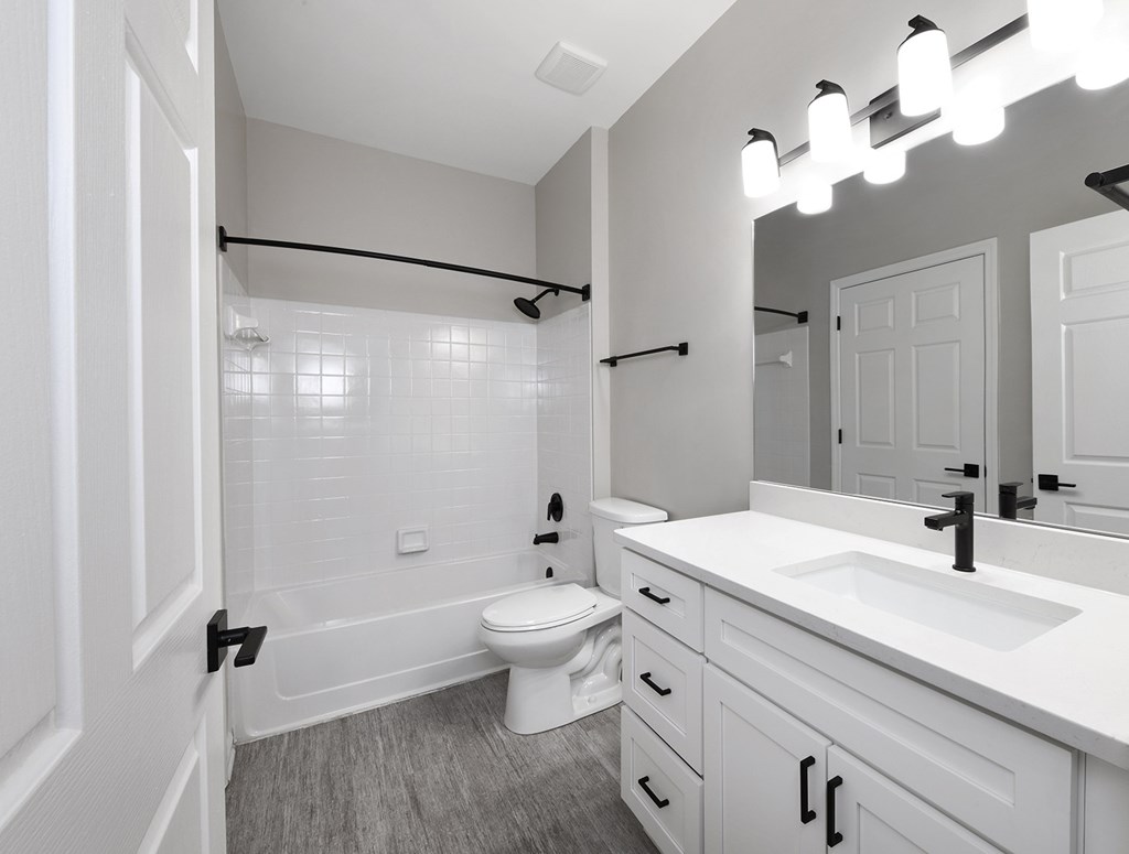 Bathrooms with quartz countertop and designer light fixtures (Legacy)